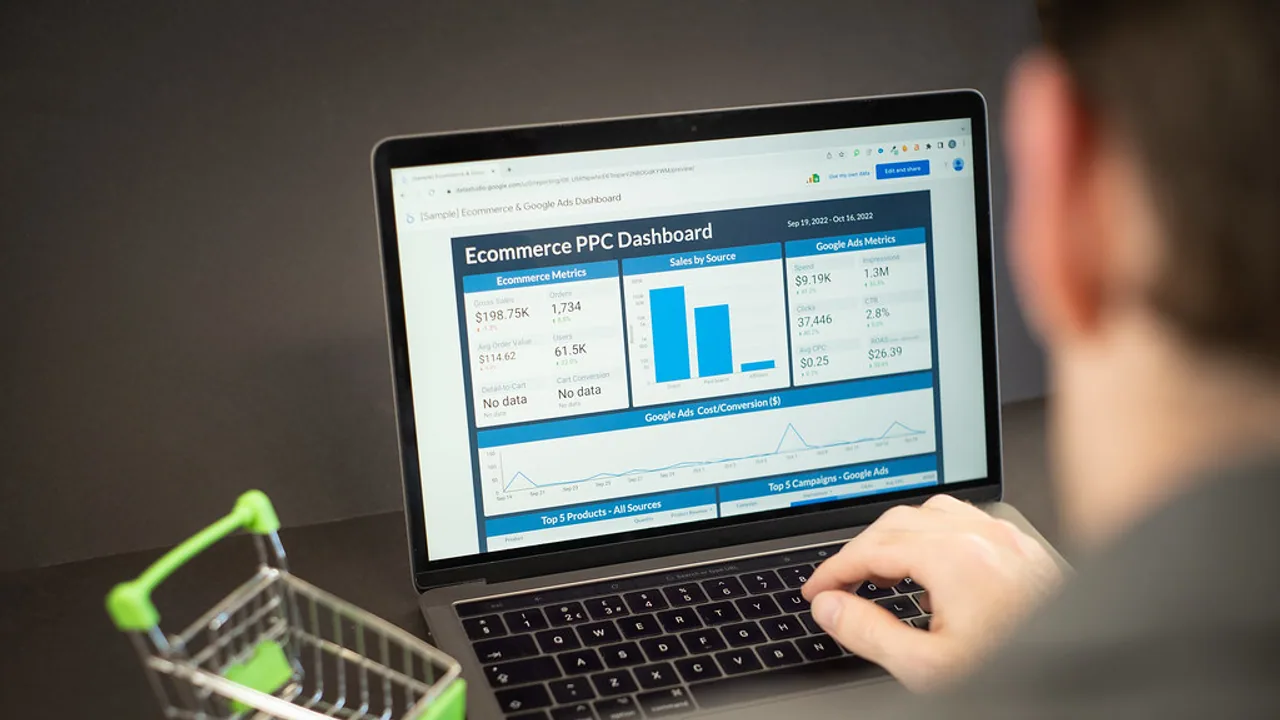 Person interpreting analytics and revenue figures on a laptop