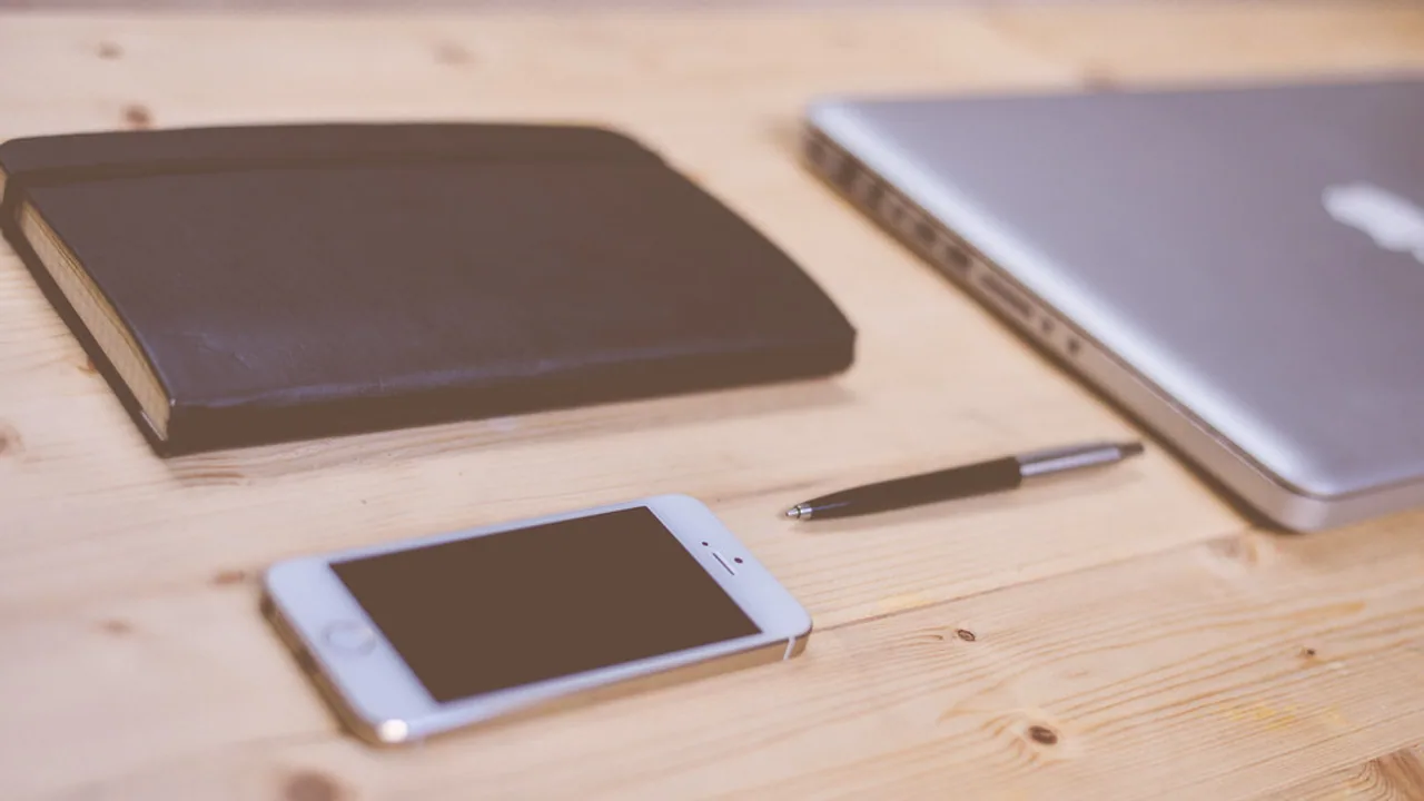Smartphone resting on a work desk